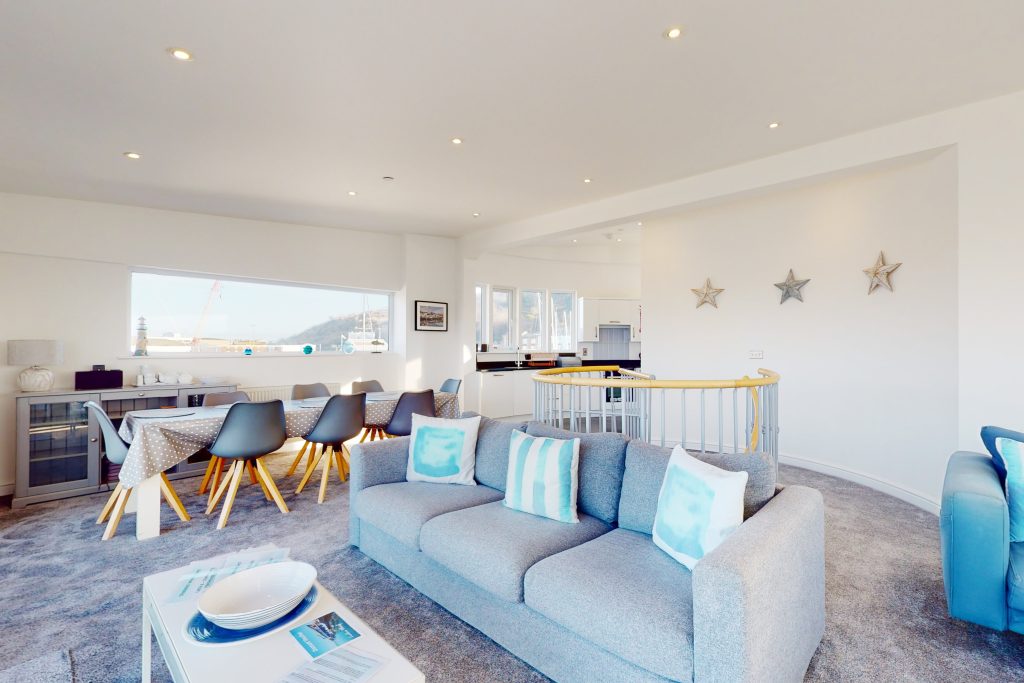 Perched on the waterfront, overlooking the harbour and marina, the apartment boasts one of the most captivating vistas in the county.