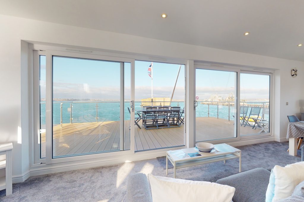 Perched on the waterfront, overlooking the harbour and marina, the apartment boasts one of the most captivating vistas in the county.