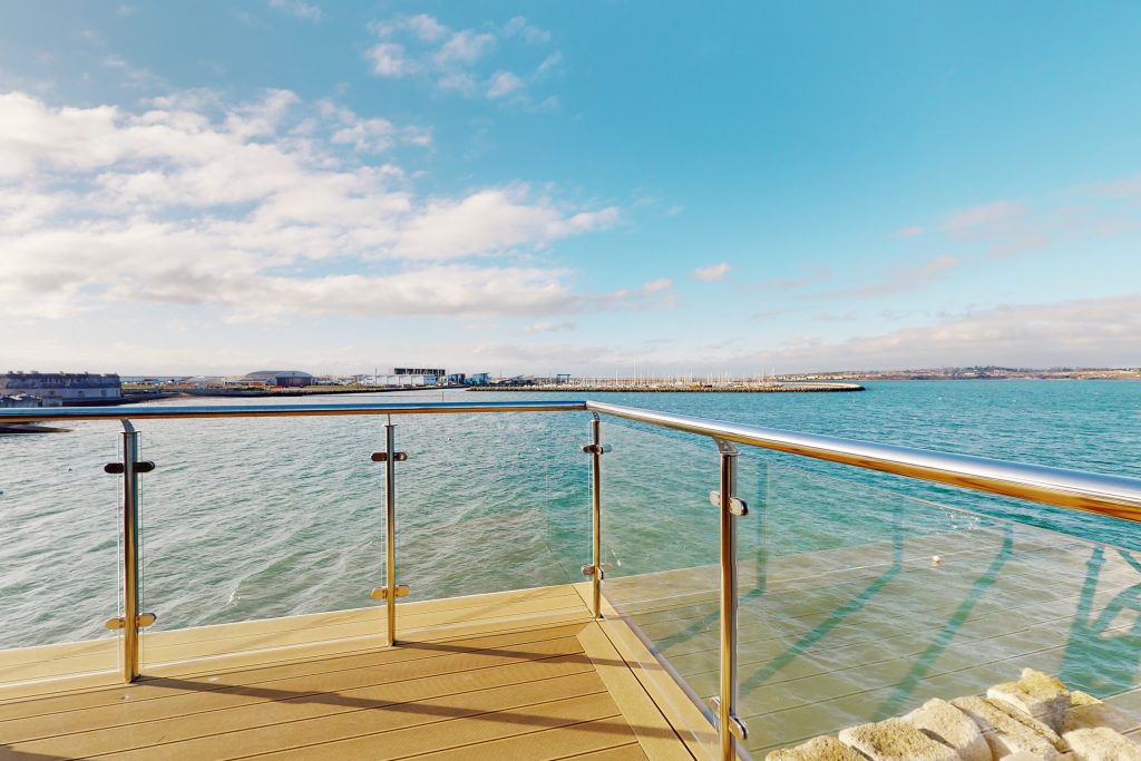 Perched on the waterfront, overlooking the harbour and marina, the apartment boasts one of the most captivating vistas in the county.