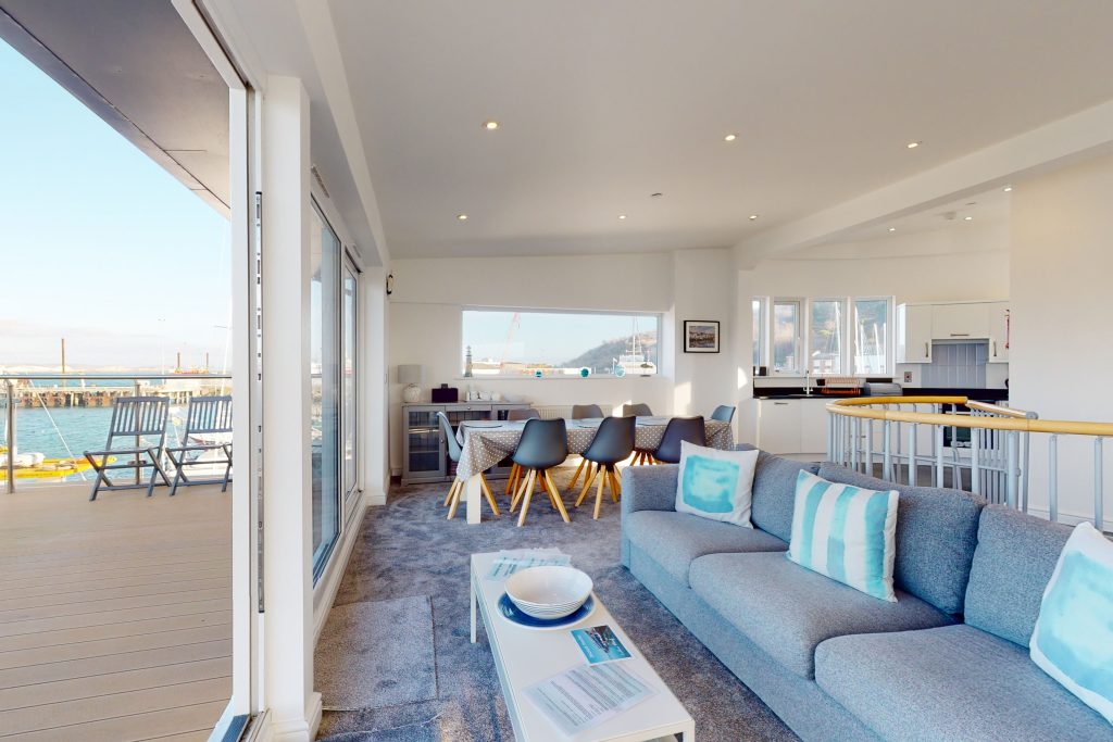Perched on the waterfront, overlooking the harbour and marina, the apartment boasts one of the most captivating vistas in the county.