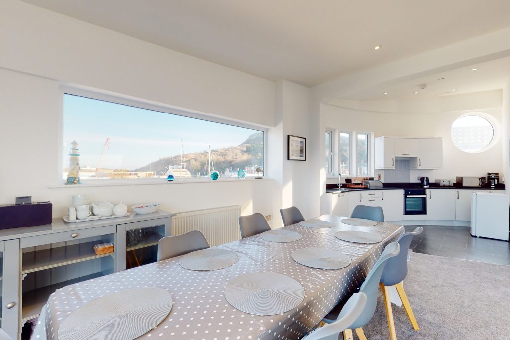 Perched on the waterfront, overlooking the harbour and marina, the apartment boasts one of the most captivating vistas in the county.