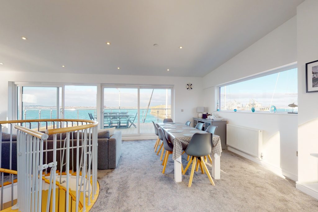 Perched on the waterfront, overlooking the harbour and marina, the apartment boasts one of the most captivating vistas in the county.