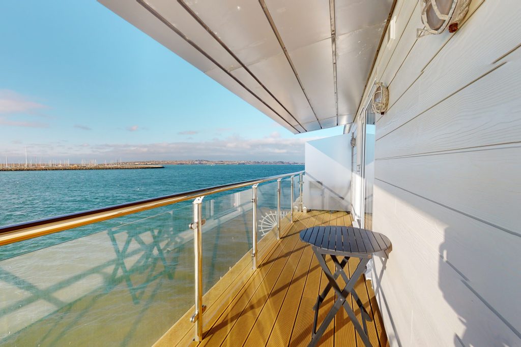 Perched on the waterfront, overlooking the harbour and marina, the apartment boasts one of the most captivating vistas in the county.