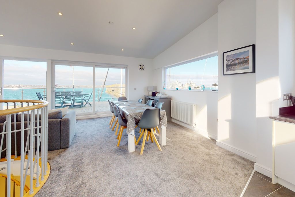 Perched on the waterfront, overlooking the harbour and marina, the apartment boasts one of the most captivating vistas in the county.