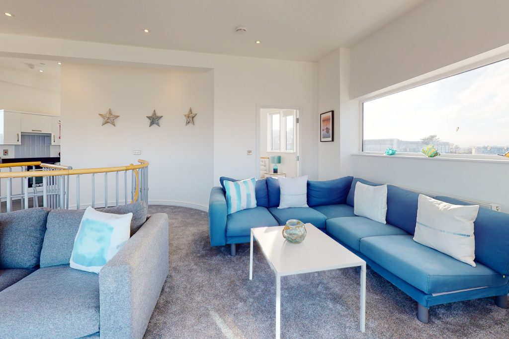 Perched on the waterfront, overlooking the harbour and marina, the apartment boasts one of the most captivating vistas in the county.