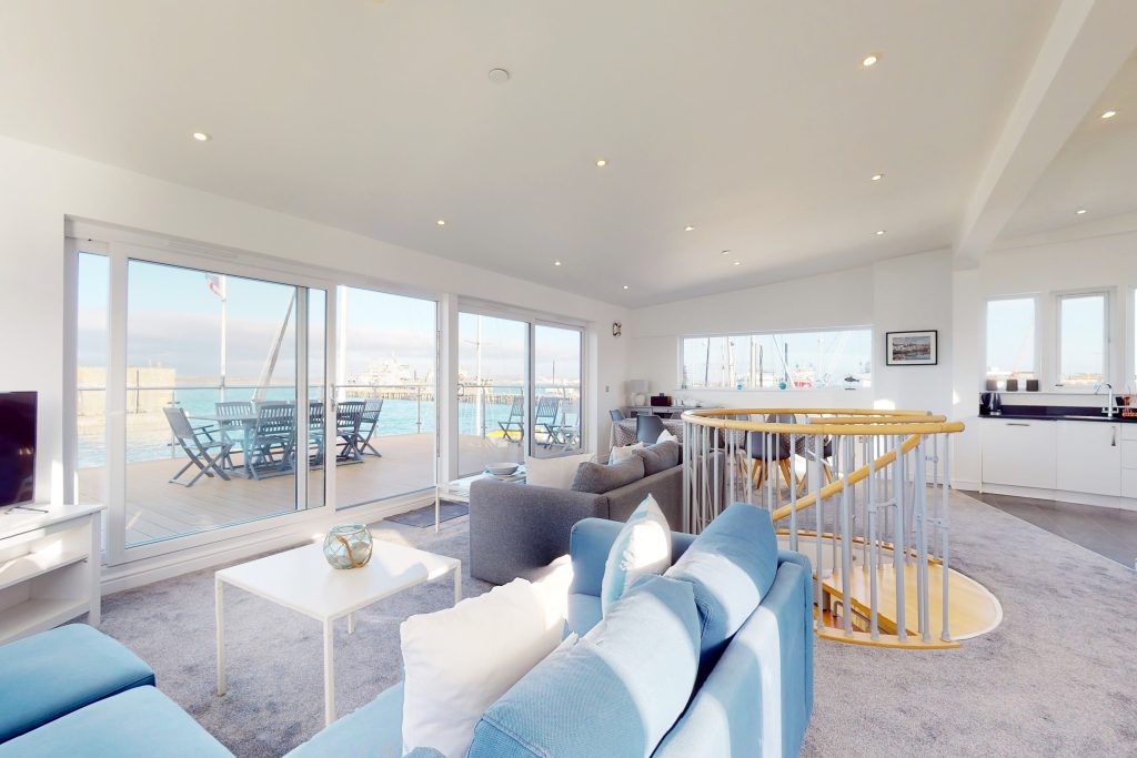 Perched on the waterfront, overlooking the harbour and marina, the apartment boasts one of the most captivating vistas in the county.