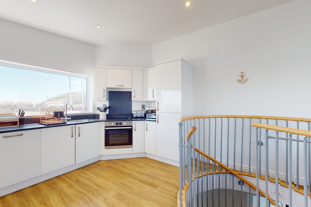 Step into the lap of luxury with this expansive three-bedroom apartment, poised majestically on the waterfront.
